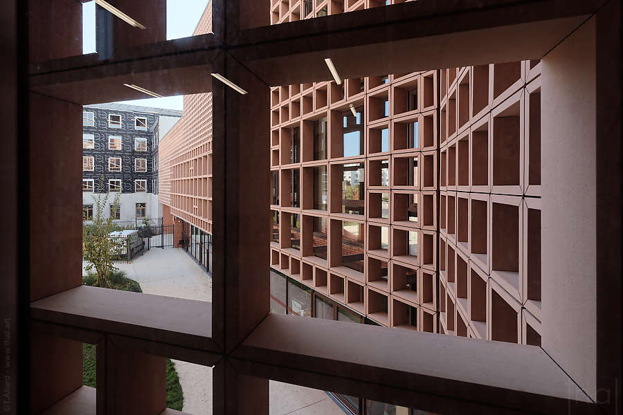 Through the terracotta structure of the Simone Veil school