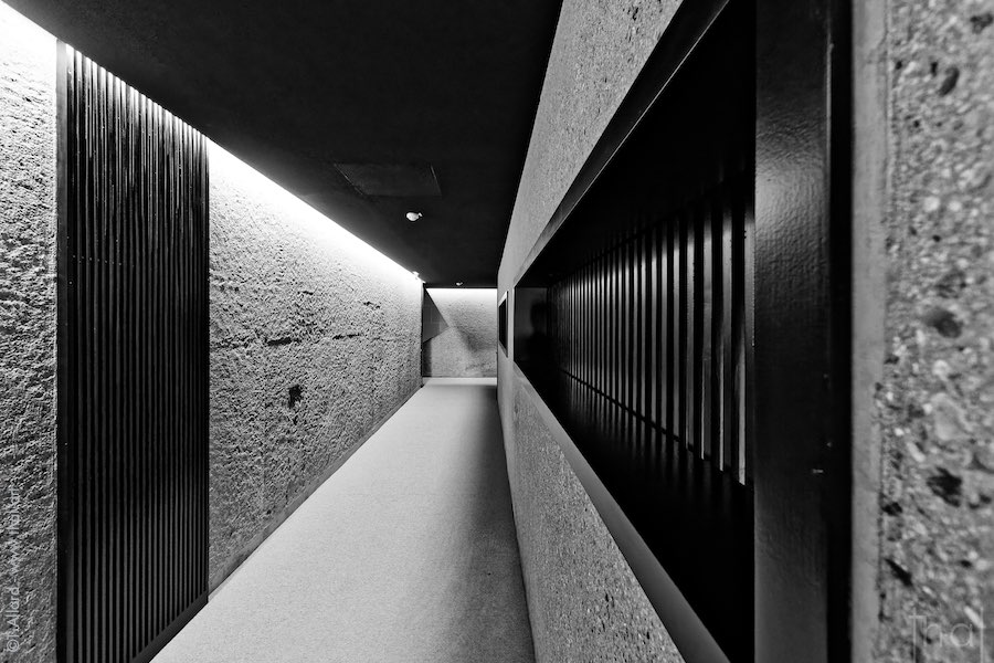 Corridor with rough concrete walls in the Conference Pavilion