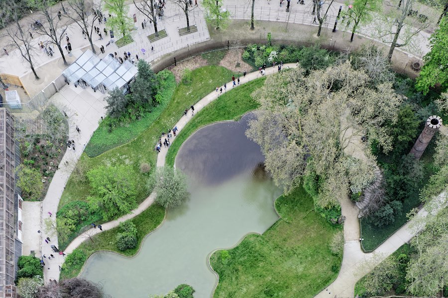 View of the garden and pond below the Eiffel Tower