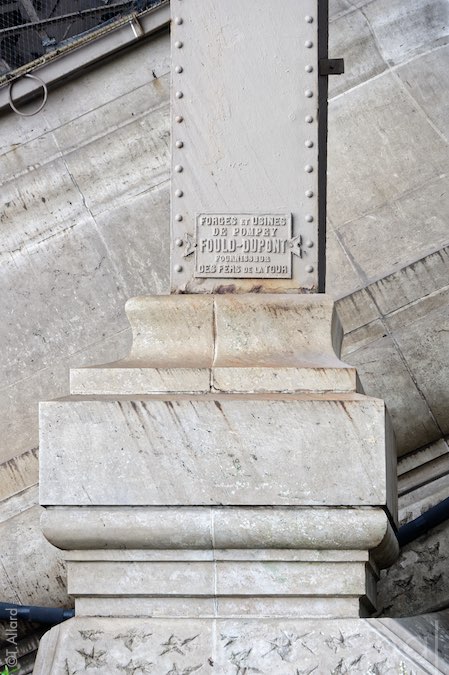 Stone pillar and base of the Eiffel Tower